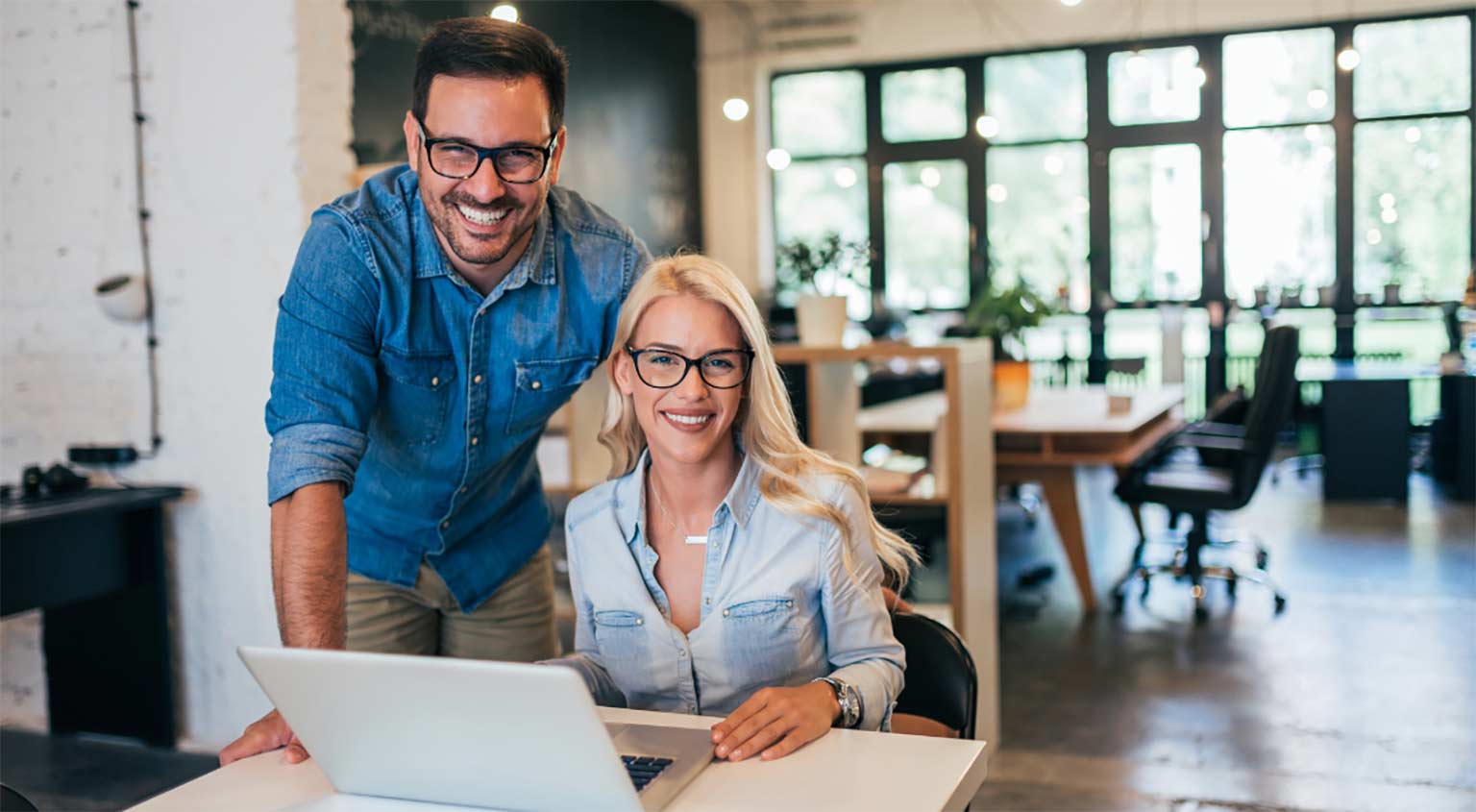Coworkers evaluating the benefits of Managed IT Services proposal for their small business